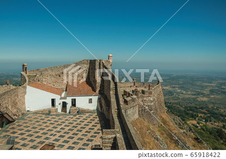 House and courtyard encircled by stone wall at the Marvao Castle 65918422