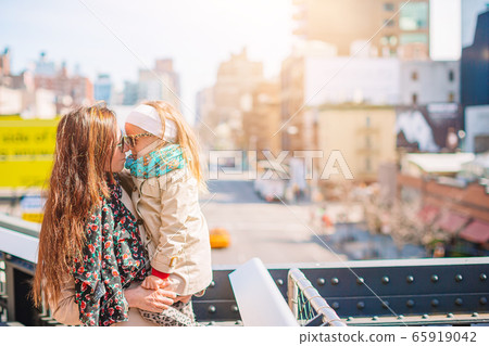 Family in public High Line Urban park in New York 65919042