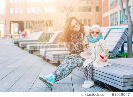 Family of mother and little kid enjoy sunny day in public High Line Urban park Family of mother and little kid enjoy sunny day in public High Line Urban park 65919047