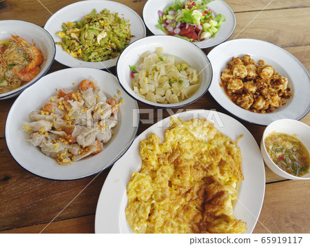 Home cook Asian Food on table Meal Omelette Garlic shrimp Fried vegetable Thai food Home cook Asian Food on table Meal Omelette Garlic shrimp Fried vegetable Thai food 65919117