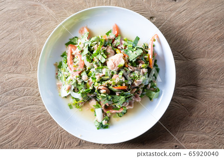 Top view of green tea leaves with tuna salad Top view of green tea leaves with tuna salad 65920040