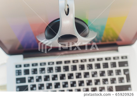 photographer monitor with Display Calibration in the office, tools for calibrating colors. photographer monitor with Display Calibration in the office, tools for calibrating colors. 65920926