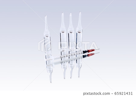 glass ampoules with medicine and syringe are 65921431