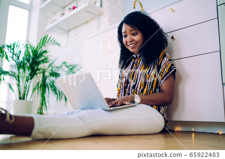 Amazed black woman working on laptop, working on freelance Amazed black woman working on laptop, working on freelance 65922483
