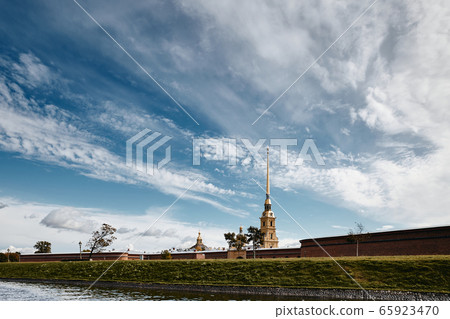 Architecture panorama of St Petersburg, Russia- architecture ensemble of Peter and Paul fortress and Neva river in sunny autumn day. Autumn architecture view of St Petersburg landmark in sunny weather Architecture panorama of St Petersburg, Russia- architecture ensemble of Peter and Paul fortress and Neva river in sunny autumn day. Autumn architecture view of St Petersburg landmark in sunny weather 65923470
