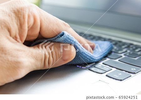 Concept Prevention cleaning frequently, Focus on the high traffic areas that enable pathogens to spread around the computer equipment such as keyboards of laptop computer Concept Prevention cleaning frequently, Focus on the high traffic areas that enable pathogens to spread around the computer equipment such as keyboards of laptop computer 65924251