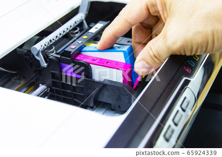 Technicians are install setup the ink cartridge of a inkjet printer the device of office automate for printing Technicians are install setup the ink cartridge of a inkjet printer the device of office automate for printing 65924339