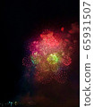 Fireworks blooming in the night sky 65931507