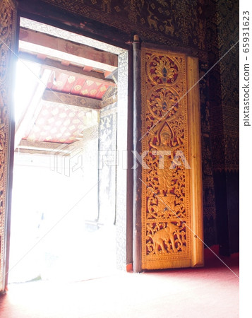 meaningful buddhism arts decorative ornaments inside temple doors WAT XIENG THONG: the famous outstanding XIENGTHONG Temple in LUANG PRABANG province ex-capital city world cultural heritage in LAOS  65931623