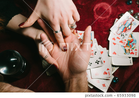 reading the lines hand in a man's hands 65933098