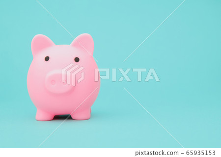 Savings concept. Moneybox in shape of pig on blue background space for text 65935153