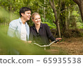 Couple in love on bikes in the park 65935538