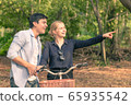 Young couple going for a bike ride on a sunny day 65935542