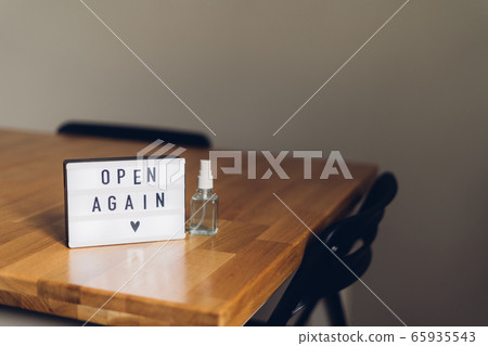 open again sigh on wooden table. local business reopen after quarantine covid-19 open again sigh on wooden table. local business reopen after quarantine covid-19 65935543
