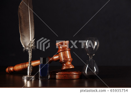 Notary's public pen, hourglass and stamp on testament and last will. Notary public tools Notary's public pen, hourglass and stamp on testament and last will. Notary public tools 65935754