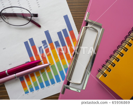 Business image, graph, binder, glasses, notebook, woman 65936869