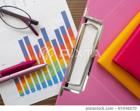 Business image, graph, binder, glasses, notebook, woman 65936870