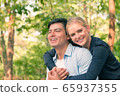 Young loving couple in the park 65937355