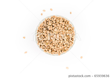 Coffee beans unroasted in glass bowl isolated Coffee beans unroasted in glass bowl isolated 65939636
