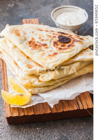 Homemade flatbread stuffed with potato herbs and 65940652