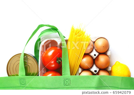 Full green bag of healthy food on a white background. Top view. fruit, vegetable, eggs online shop. your text. food delivery 65942079