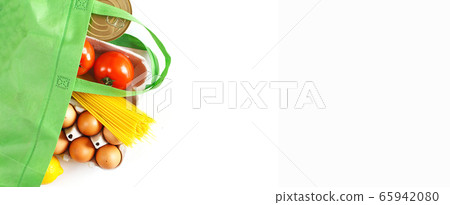 Full green bag of healthy food on a white background. Top view. fruit, vegetable, eggs online shop. your text. food delivery 65942080