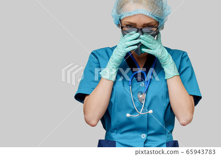 female doctor with stethoscope wearing protective mask and latex gloves over light grey background female doctor with stethoscope wearing protective mask and latex gloves over light grey background 65943783