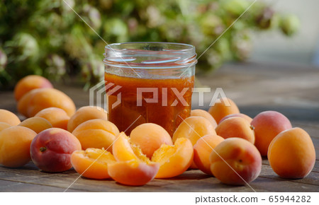 Apricots and pot of jam Apricots and pot of jam 65944282