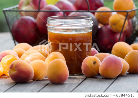 Apricots and pot of jam 65944513