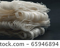 Preserve noodles on a black background. 65946894
