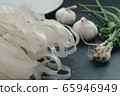 Noodles and garlic and coriander 65946949