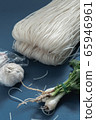 Noodles and garlic and coriander 65946961