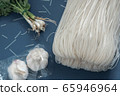 Noodles and garlic and coriander 65946964