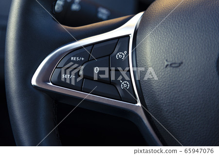 control buttons on the steering wheel of a modern car control buttons on the steering wheel of a modern car 65947076