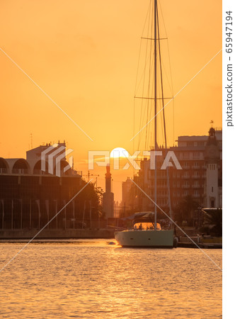 sunrise at the Valencia harbor, Spain Sunset at the port of Valencia, Spain colors in the sky and water reflection 65947194