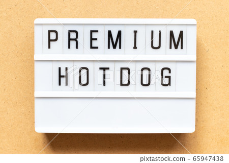 Lightbox with word premium hotdog on wood background 65947438