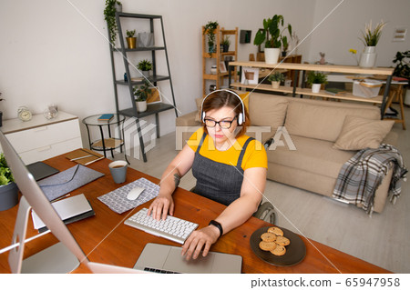 Female programmer working at home Female programmer working at home 65947958