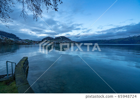 Evening view of Thuner lake in Switzerland Evening view of Thuner lake in Switzerland 65948724