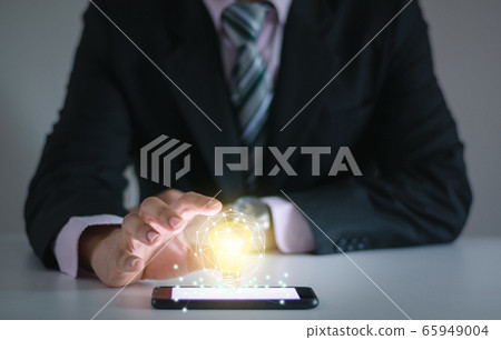 Light bulb new ideas with innovative technology solution concepts hands of the businessman. 65949004