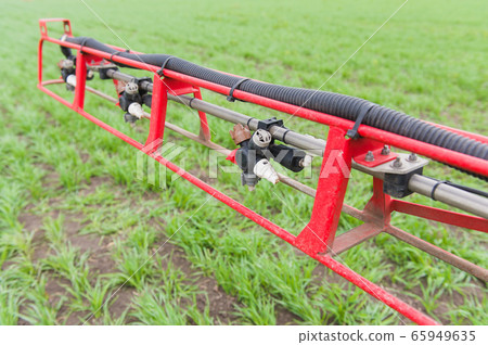 Close up liquid valve at sprayer boom 65949635