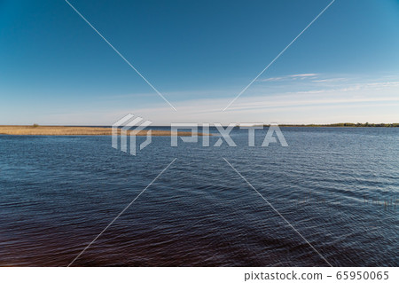 Russia. Leningrad region. The outlet to Ladoga lake, the Volkhov river at dawn in the spring. 65950065