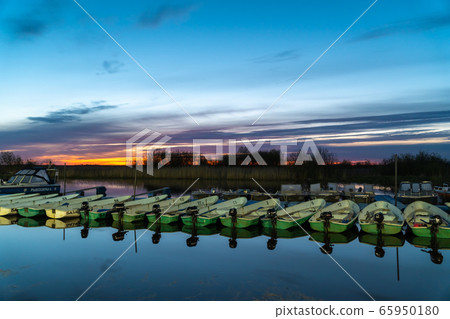 Russia. Leningrad region. Pleasure boats and boats at dawn in the Bayou of lake Ladoga near the city of Novaya Ladoga. 65950180