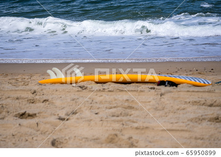 surf board by the sea on the sand surf board by the sea on the sand 65950899