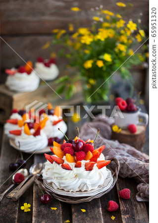Delicious Pavlova meringue cake decorated with 65951320