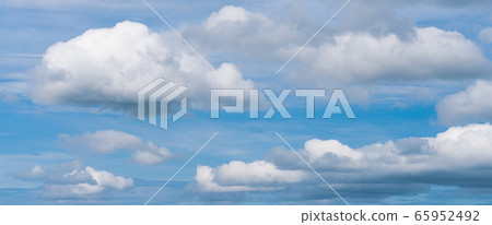 Stunning colorful panoramic view of sunny blue sky with white clouds. Summer panorama of weather background Stunning colorful panoramic view of sunny blue sky with white clouds. Summer panorama of weather background 65952492