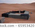 A tent that stayed overnight in the Sahara 65953420