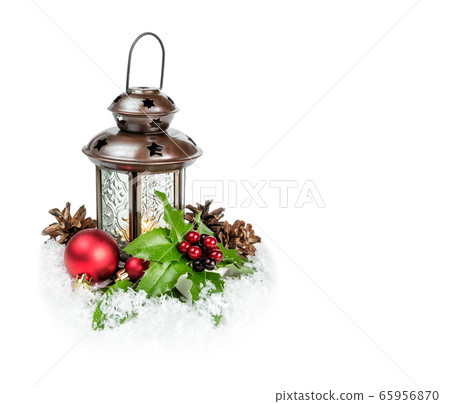 Lantern and holly berries on a snow Lantern and holly berries on a snow 65956870