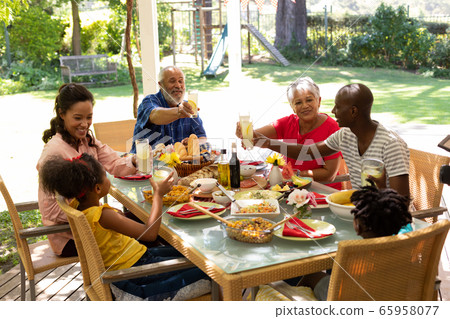 Family eating together at table Family eating together at table 65958077
