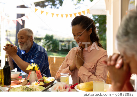 Family eating together at table Family eating together at table 65958082