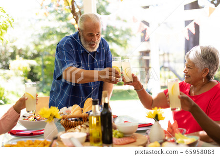Family eating together at table 65958083
